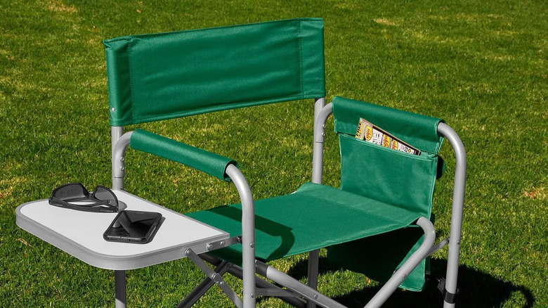Harbor Freight folding chair with phone, sunglasses, and magazine