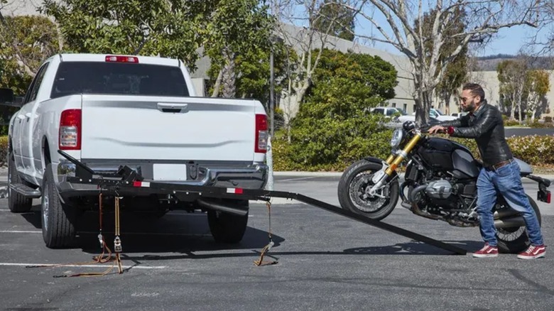A person place a bike on the Haul-Master Motorcycle Carrier.
