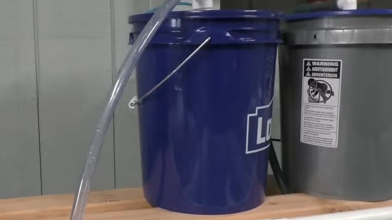 A 5-gallon bucket turned into a water filter system.