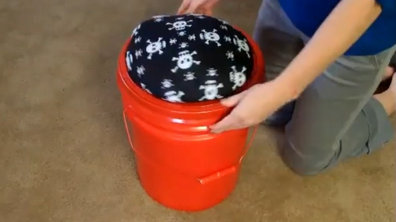 A 5-gallon bucket converted into a stool.