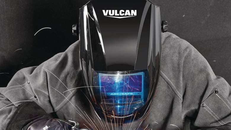 Welder wearing Vulcan welding helmet