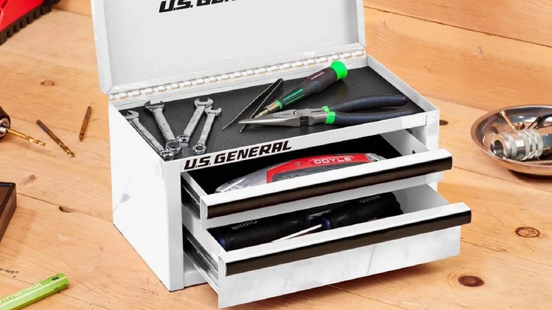 The U.S. General Mini Steel Toolbox from Harbor Freight shown with all its drawers open on a table