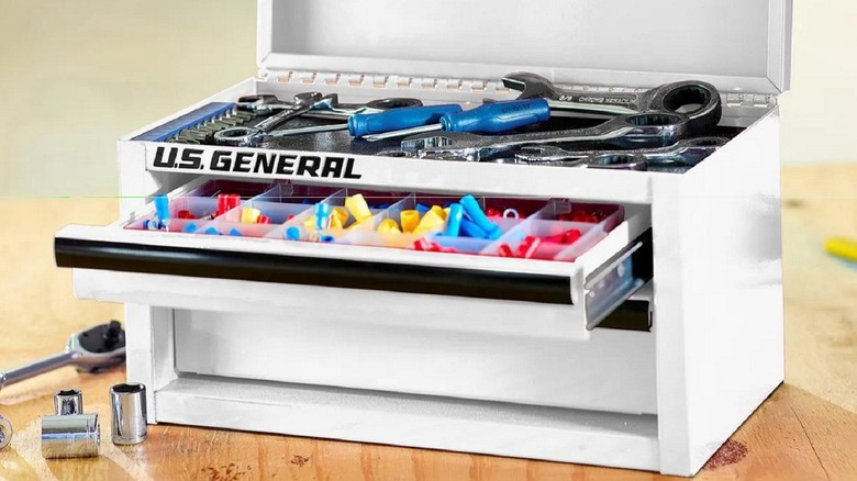 The U.S. General Mini Steel Toolbox from Harbor Freight shown with its top drawer open on a table