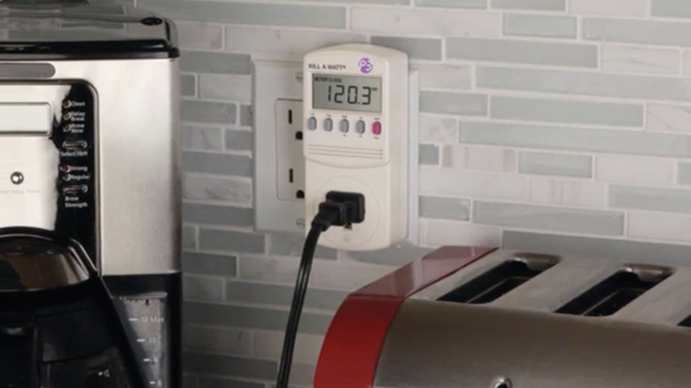 Watt monitor plugged into wall