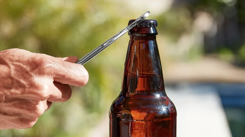 Pittsburgh 5/8-in. Wrench Bottle Opener being used on bottle