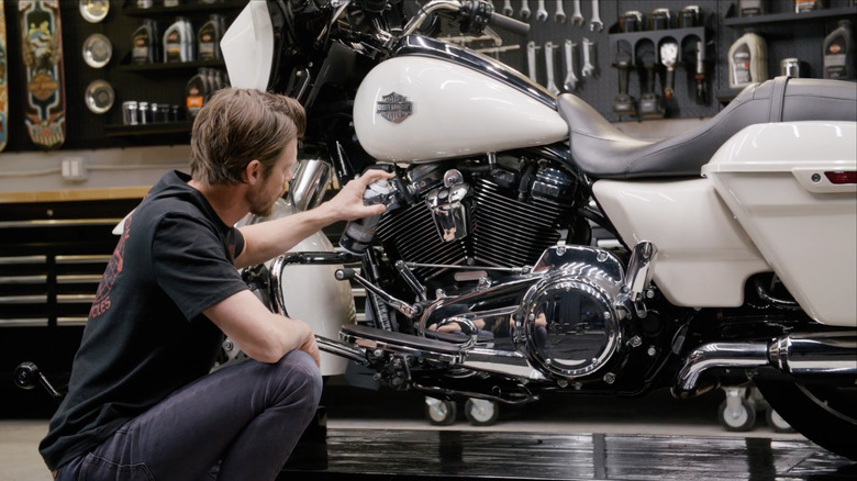 A Harley-Davidson employee demonstrating the Engine Brightener