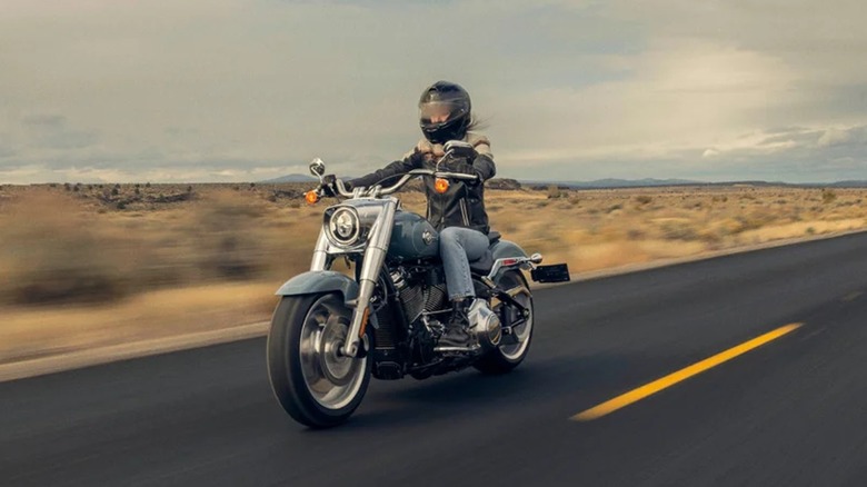 Person riding Harley Fat Boy