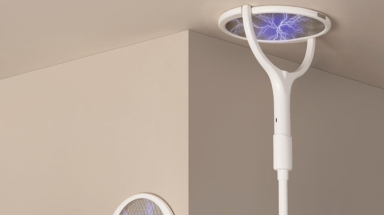 electric fly swatter used on ceiling