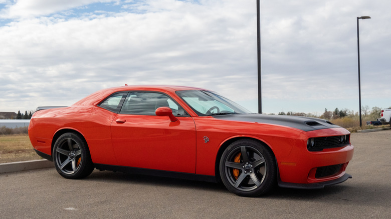 Red Dodge Charger Hellcat in parking lot