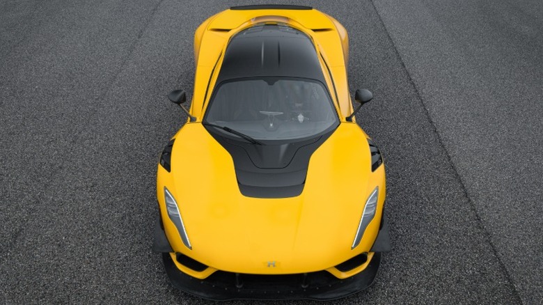 Top-down view of a yellow Hennessey Venom F5 hypercar parked