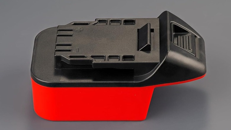 An adaptor that allows using M18 Milwaukee batteries on some 20V Hercules power tools.