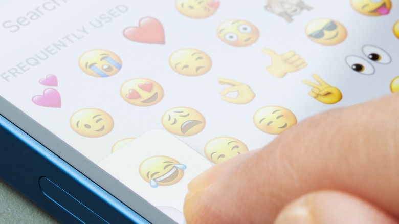 Someone using Emoji on iPhone