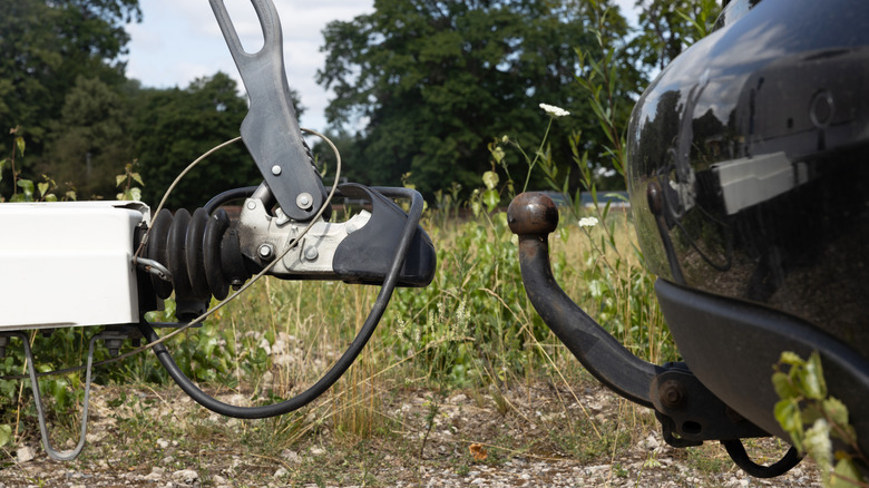 A trailer separated from a vehicle's hitch.