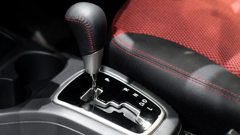 Black gear shifter with "L" in a car's interior