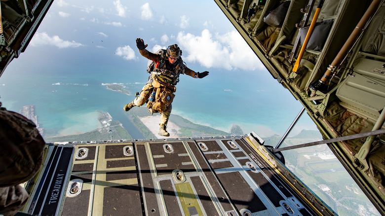 Special ops soldier jumping from the ramp of a airborne aircraft