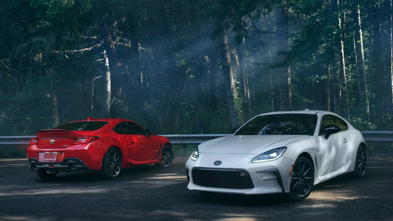 Scenic shot of red and white Toyota GR86s