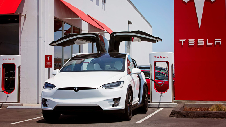 A Tesla Model X connected to a charger 