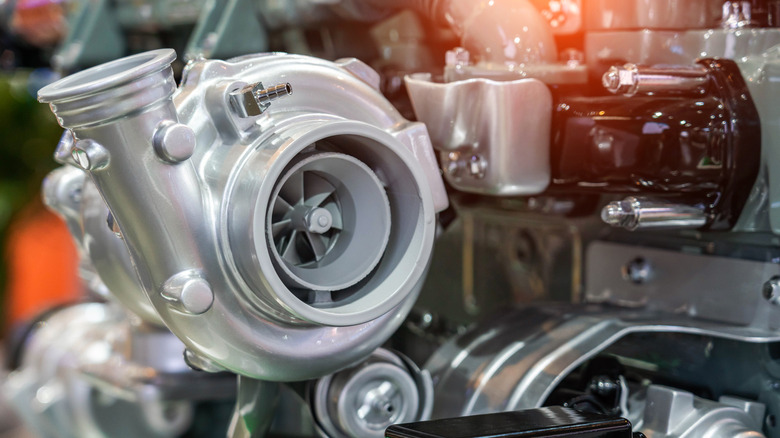 Close-up of a silver turbocharger on an engine