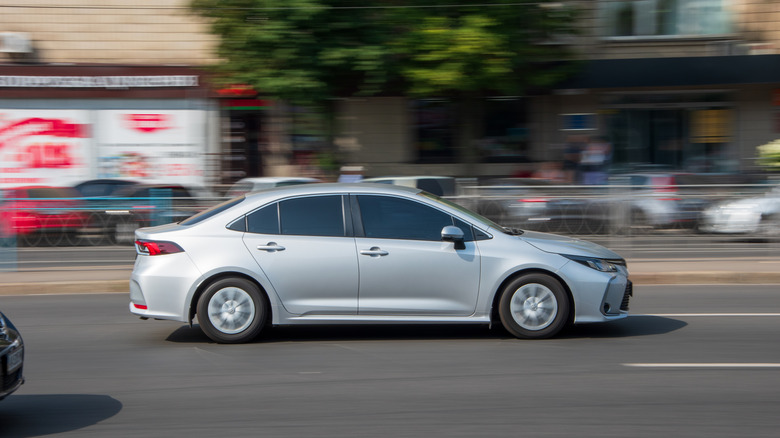 2021 toyota corolla driving on the city street