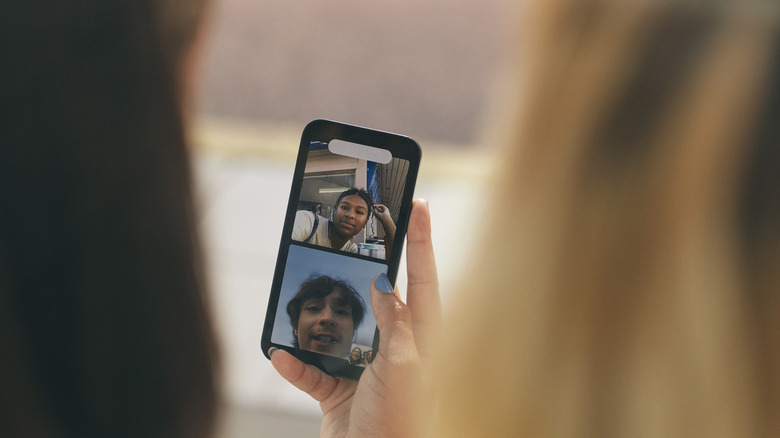 woman on a video conference call with two people