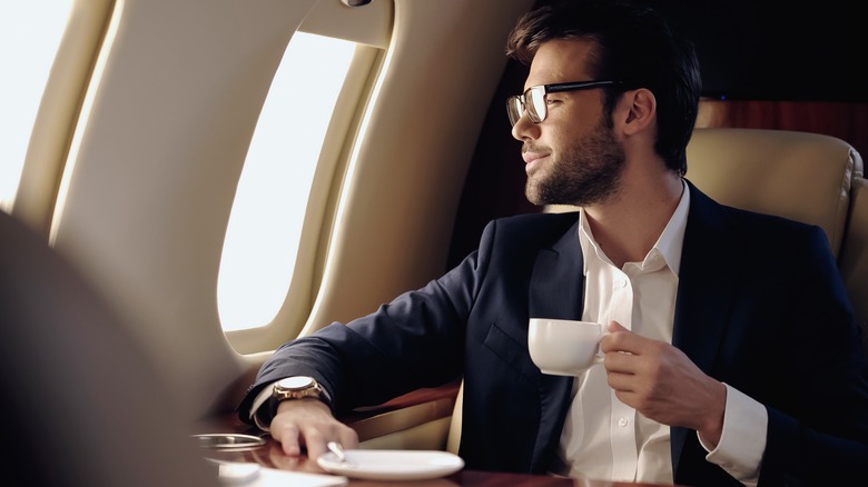 Person looking out of airplane window