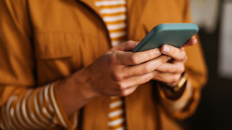 Person holding smartphone