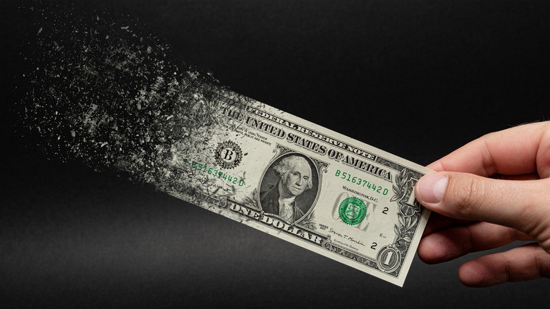 Dollar bill disintegrating