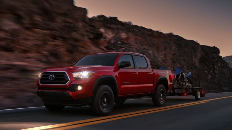 2023 Toyota Tacoma driving towing trailer