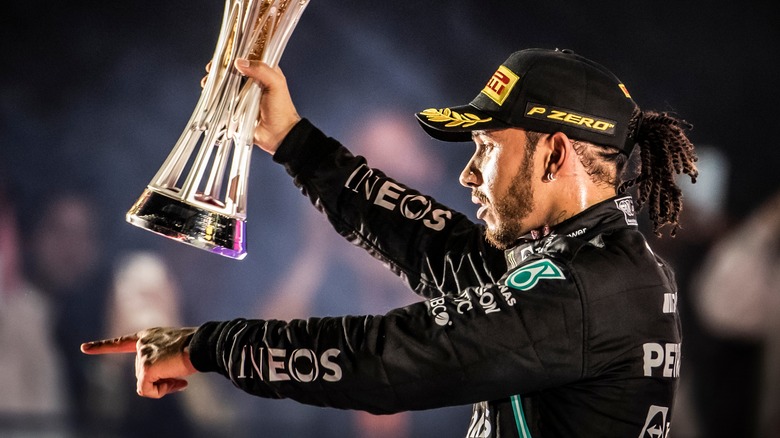 Lewis Hamilton celebrating with trophy