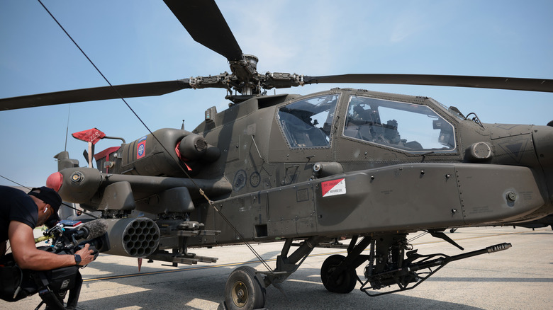 Side view of Apache helicopter on the ground.