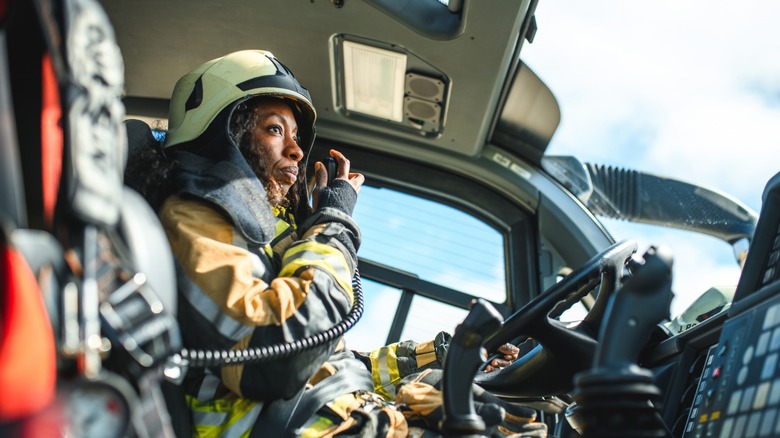 female firefighter talking into CB radio