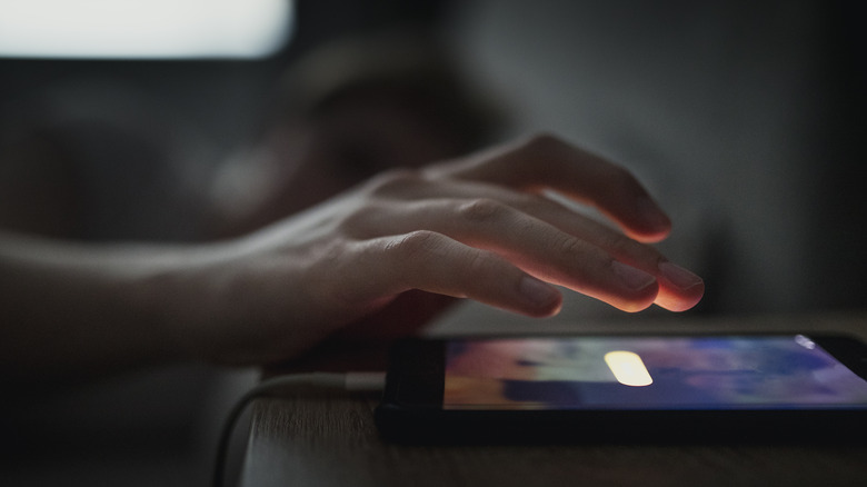 Alarm ringing on a phone lying on a table