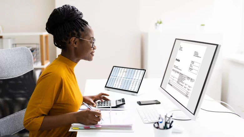 Woman using desktop computer