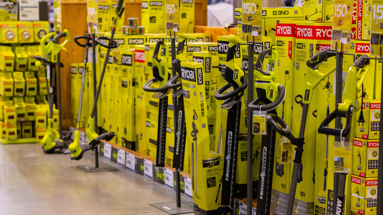 Group of Ryobi outdoor tools in a store