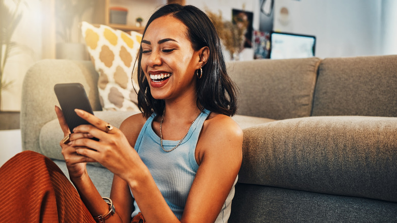 happy woman using smartphone