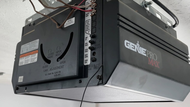 The Rear Of A Genie Pro Max Garage Door Opener Showing The Learn Code Button