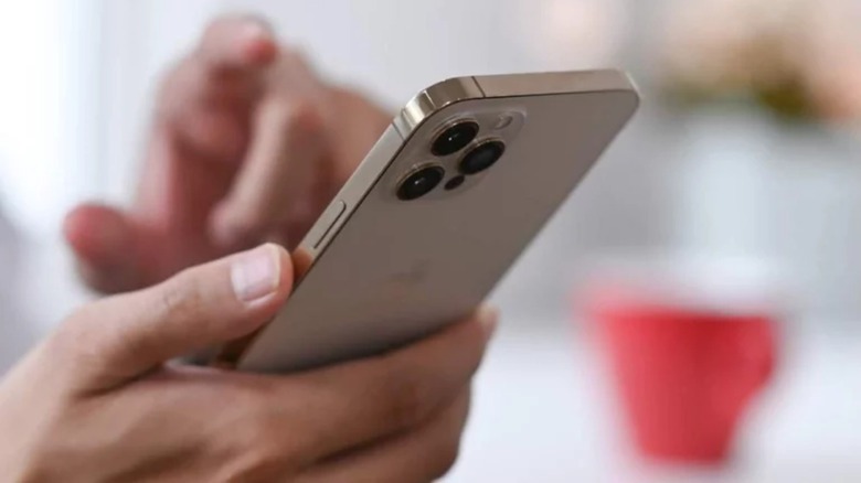 Man holding iPhone 12