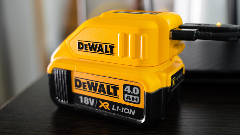 A DeWalt battery connected to the charger.