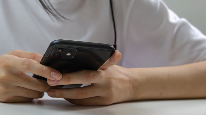 girl holding iphone