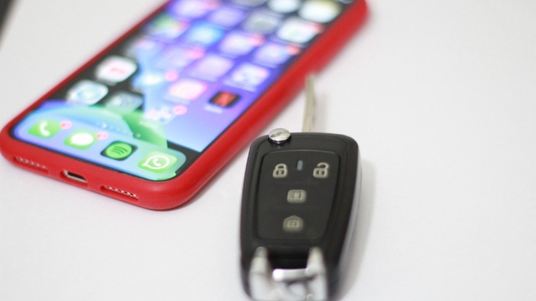 Car keys next to an iPhone