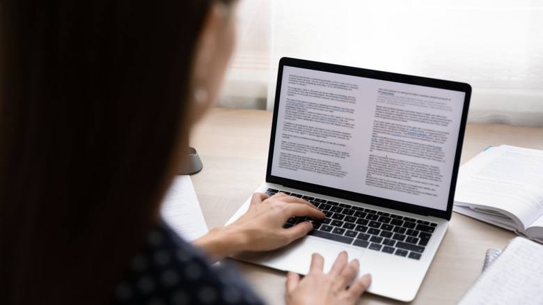 woman typing document