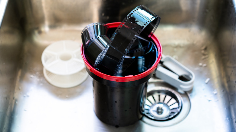 film development tank with film in sink