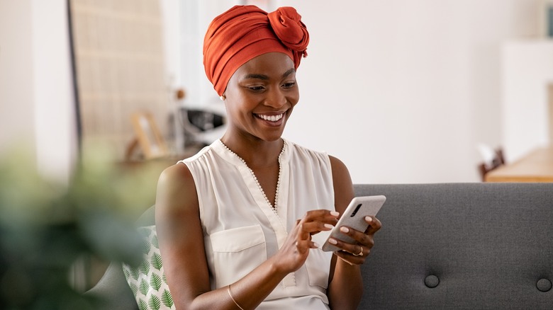 Woman uses smartphone
