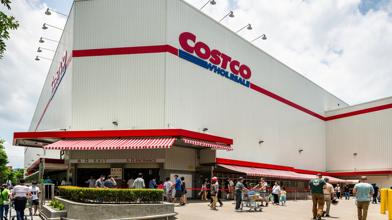 Shoppers outside of a Costco store