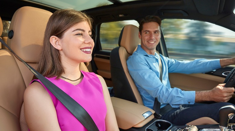 Woman smiling inside car