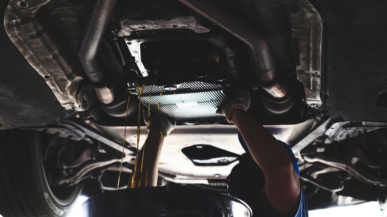 person servicing transmission ATF flush