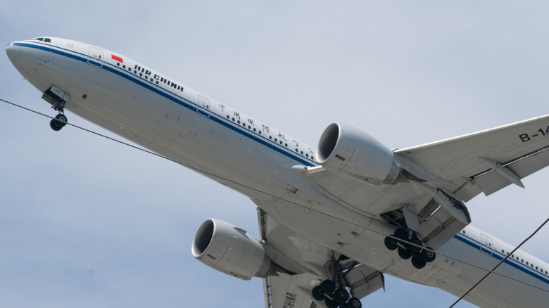 Boeing 777 airliner in flight