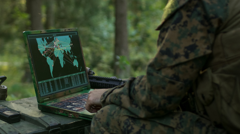 Soldier using a military laptop