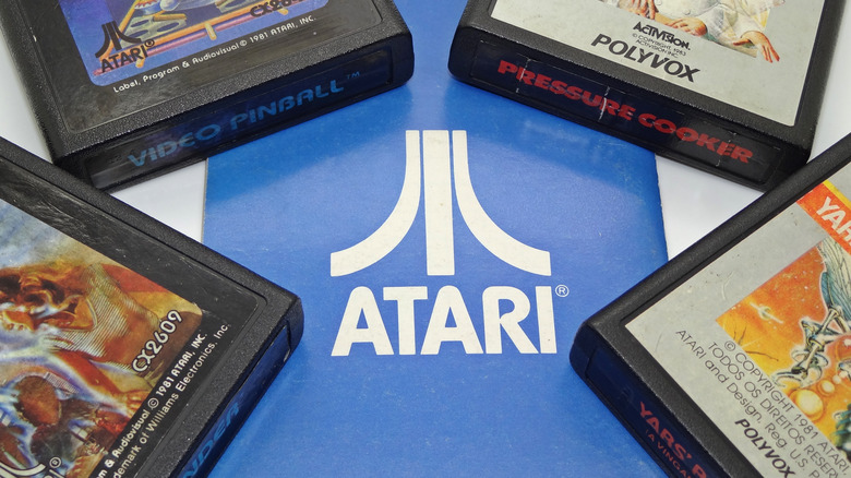 Atari logo with game cartridges