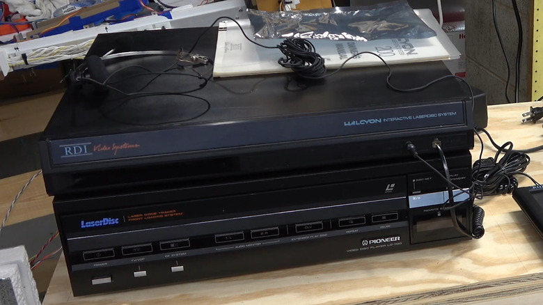 Close up of RDI Halcyon system and LaserDisc Pioneer on a bench with cables around it